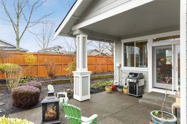 Yard equipped with sprinkler system for low maintenance gardening.