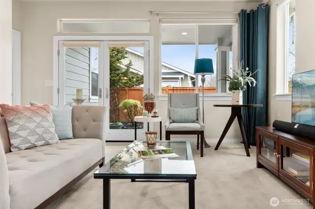 Open and spacious living room with access to covered back patio.