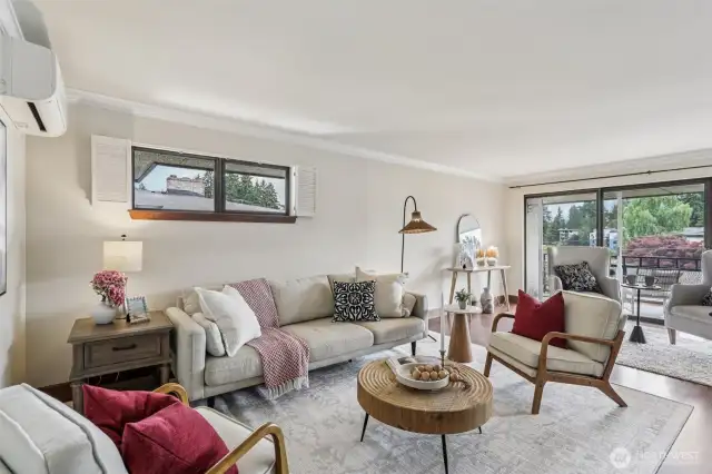 Sliding Door in Living Room Opens to Covered, Private Deck With View of Bitter Lake