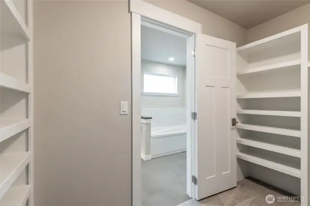 Custom build shelves in primary closet of like home