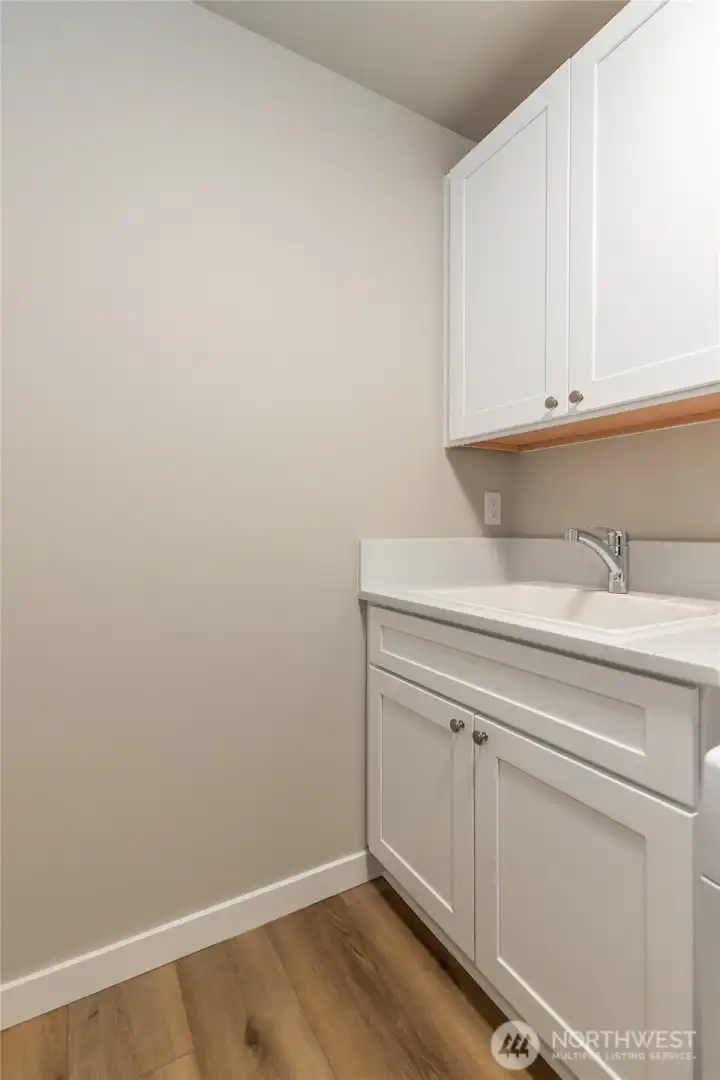 Upper level laundry area of like home