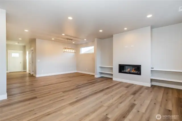 Living/dining room with gas fireplace of like home