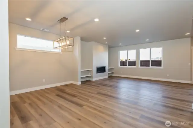 Living/dining room with gas fireplace of like home