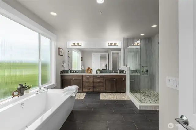 Luxurious Primary Bath with dual vanity, soaking tub, large shower and spacious walk-in-closet