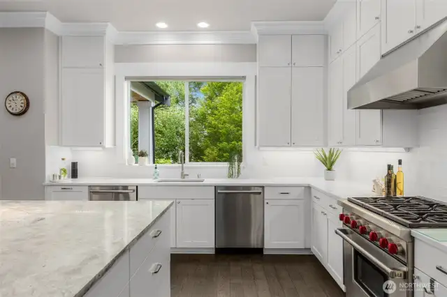 Kitchen overlooks the expansive back yard so you can keep an eye on activity in back while prepping meals and washing dishes