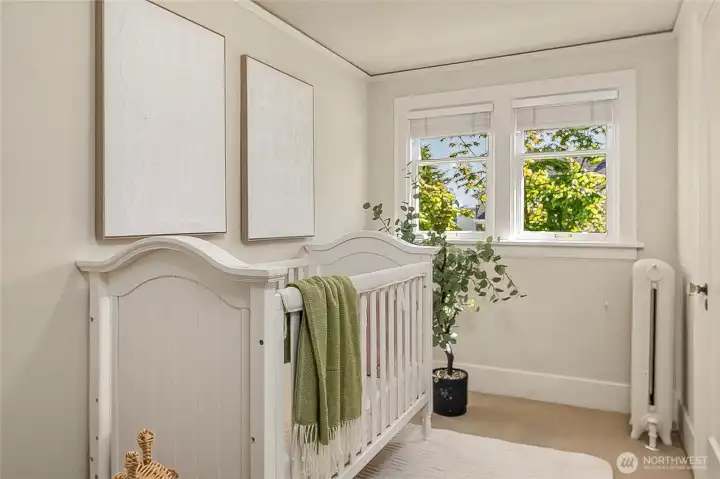 Small upstairs bedroom makes a darling nursery or can easily support a twin bed.