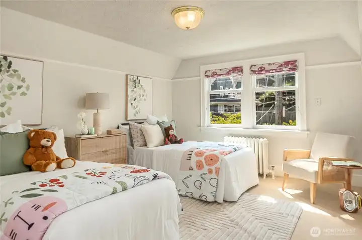 Large second bedroom has coved ceilings and faces Galer street.