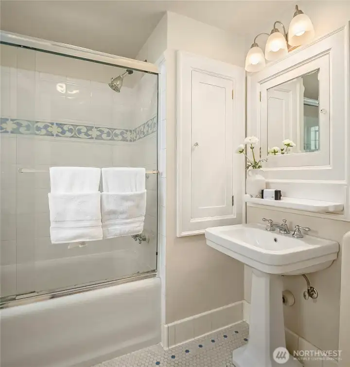 Vintage full bathroom on the second floor! Love those hexi-tile floors!
