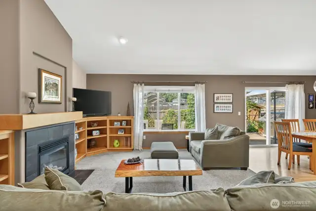 Looking through the family room toward the dining area and there is a slider out to the back deck. More of the beautiful hardwood floors.