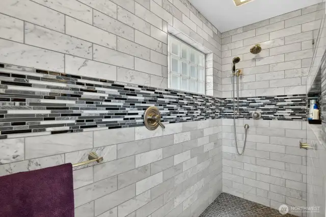 Large walk in shower all tile with dual shower heads. Beautifully done!