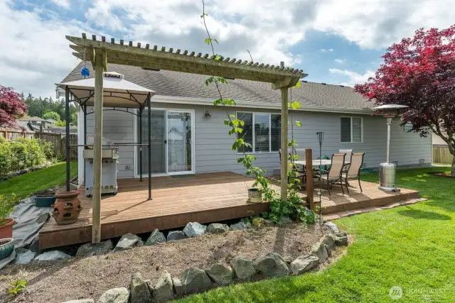 Trellis adds some detail to the yard along with rock touches.