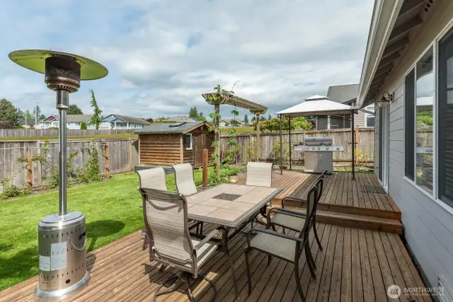 Nice garden shed for potting and storage. Pergola on the deck stays with the house.