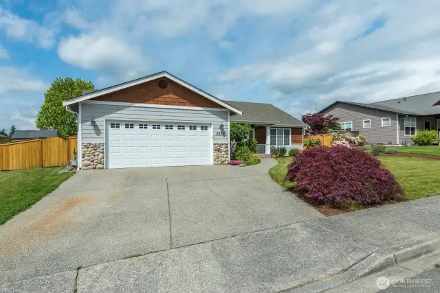 Paved driveway, curbs, and sidewalks. Welcome home to this complete package!