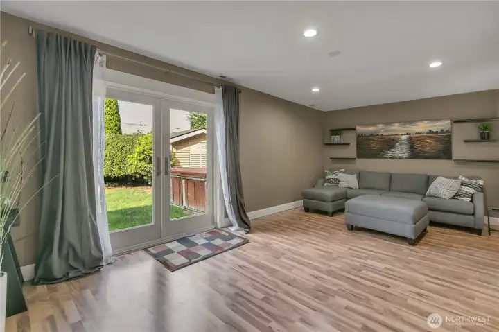 As you enter the family/media/play room, you'll see how spacious it is plus the second set of French doors lead to the private back yard.