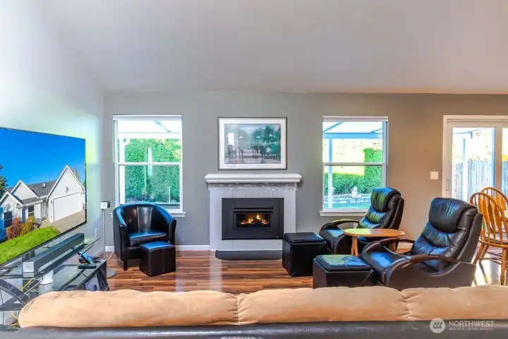 Laminate flooring throughout, gas fireplace with remote, & vaulted ceilings.