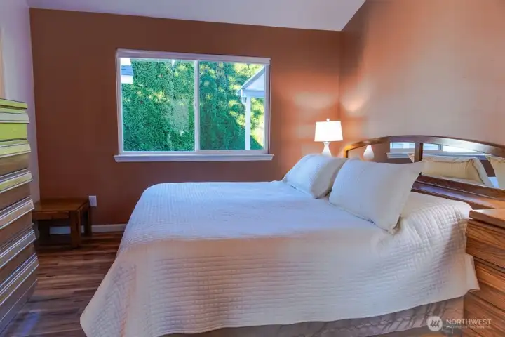 Primary suite also features vaulted ceilings.