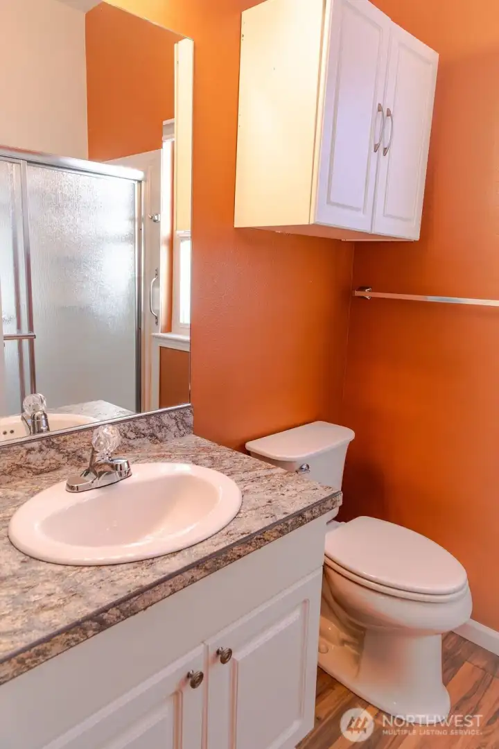 3/4 bath in the primary suite with skylight.