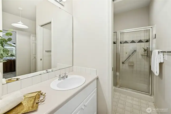 The primary bathroom with tiled shower.