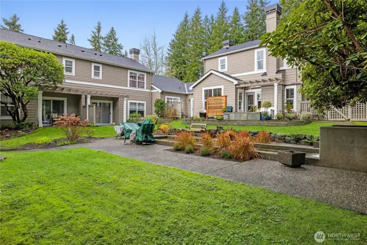 Lush park-like grounds surround this beautiful townhome.
