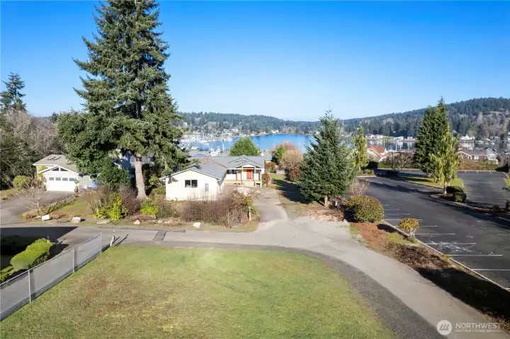 This charming vacant parcel is tucked away on a quiet dead end street, offering privacy while being just moments from the waterfront.  Year round view of the harbor and Puget Sound