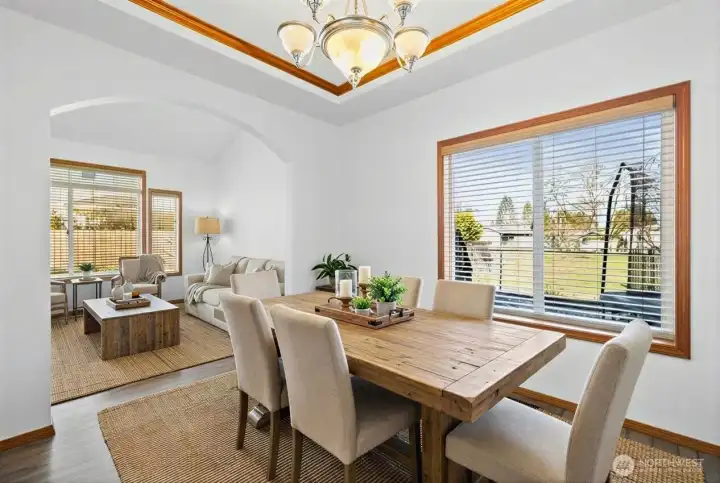 Spacious dining room blends into the formal living room, creating a welcoming envinroment for entertaining. (photo virtually staged)