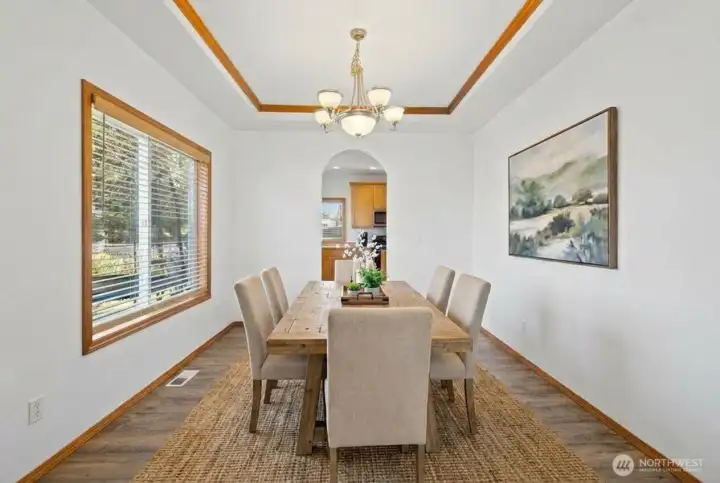 Dining room leads to the kitchen. (photo virtually staged)