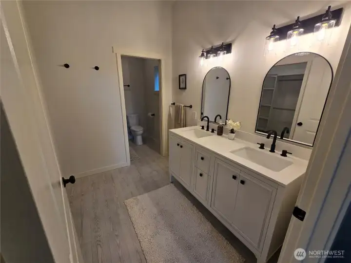 Master bath has heated tile floors, double sinks and full size shower. Master bath has heated tile floors, double sinks and full size shower.