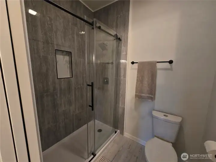 Never have a cold morning with heated floors and forced air heated shower room, with floor to ceiling tile in full sized shower. Never have a cold morning with heated floors and forced air heated shower room, with floor to ceiling tile in full sized shower.