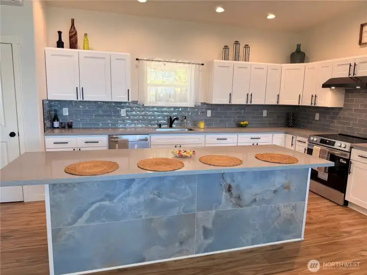 Large kitchen island can comfortably seat 5. Large kitchen island can comfortably seat 5.