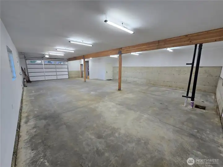Insulated 1340 square foot garage with tandem parking for 2 vehicles and plenty of room for workshop, office space, plumbing stubbed out for wash room, pet wash, etc. Insulated 1340 square foot garage with tandem parking for 2 vehicles and plenty of room for workshop, office space, plumbing stubbed out for wash room, pet wash, etc.
