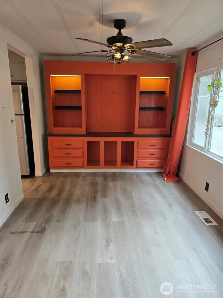 Built in hutch in dining room w/ceiling fan