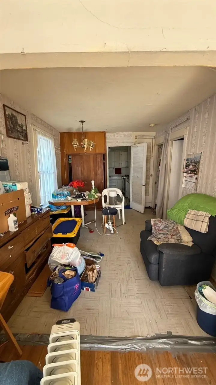 Dining room with adjoining kitchen.