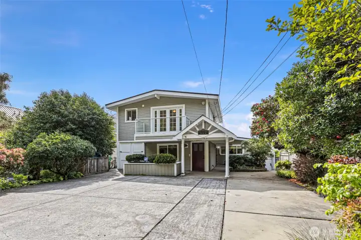 2 Parking spaces on the left side of the parking.   pad.  Walkway down to the water on the right side.