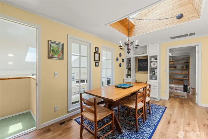 Dining area leads to a lower bonus room or office