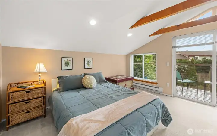 Upstairs bedroom can be used as a primary bedroom or additional office/fitness space.  Slider onto deck.