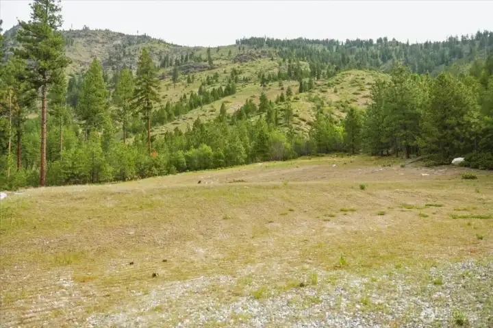 Large leveled spot for a homesite, shop, or recreation.