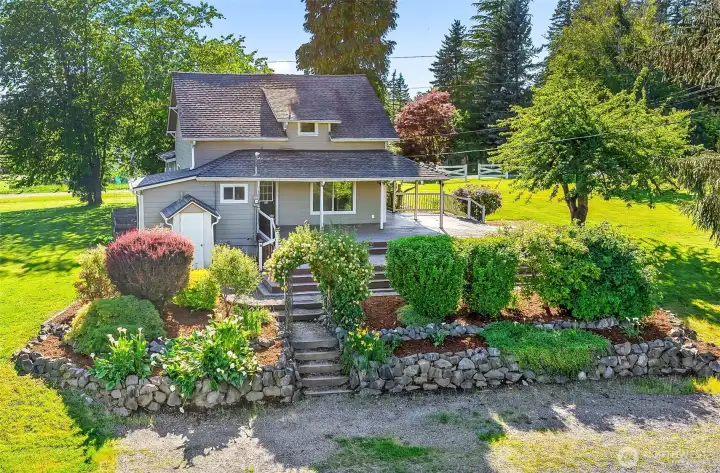 1.5 story 1912 Farmhouse on almost 9 fenced acres.
