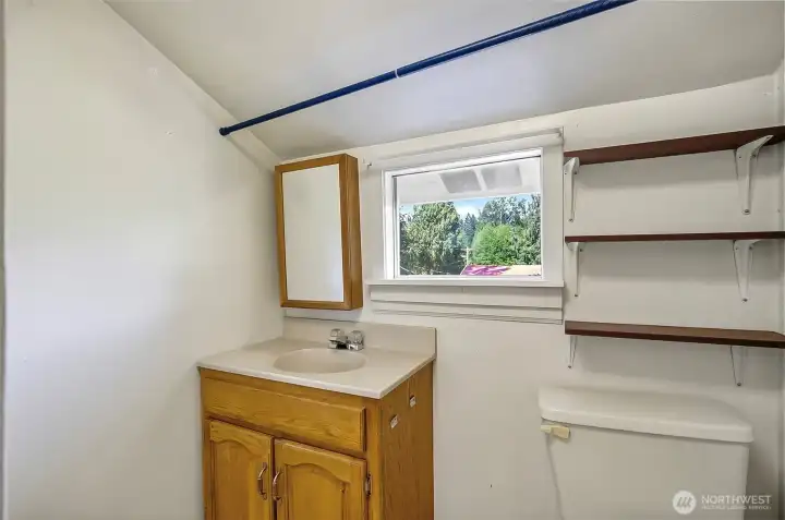 Upstairs 3/4 bath.  Stand up shower located directly across from the sink