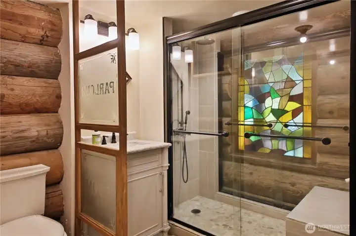 Gorgeous main floor bath feaitures a beautiful stain glass panel!