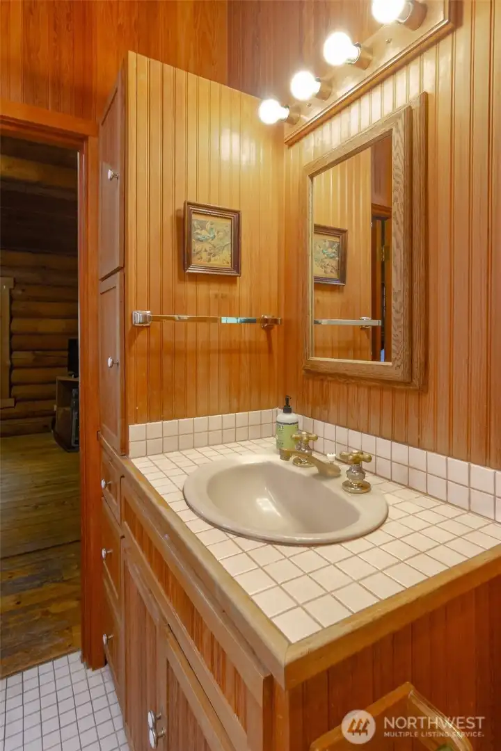 the roomy bath has a nice closet for storage too!