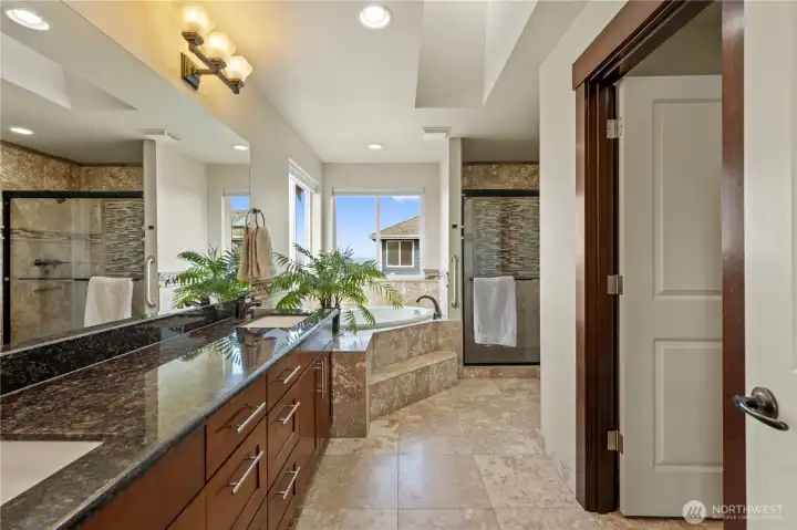 Spa-inspired luxury awaits with travertine finishes and timeless design.
