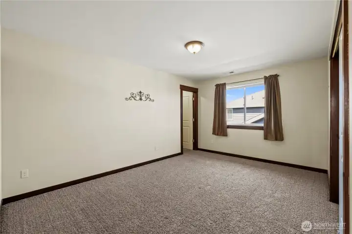 Generously sized secondary bedroom filled with natural light.