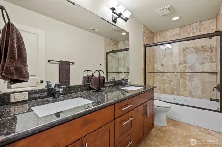 Well-appointed full bath conveniently serving the secondary bedrooms.