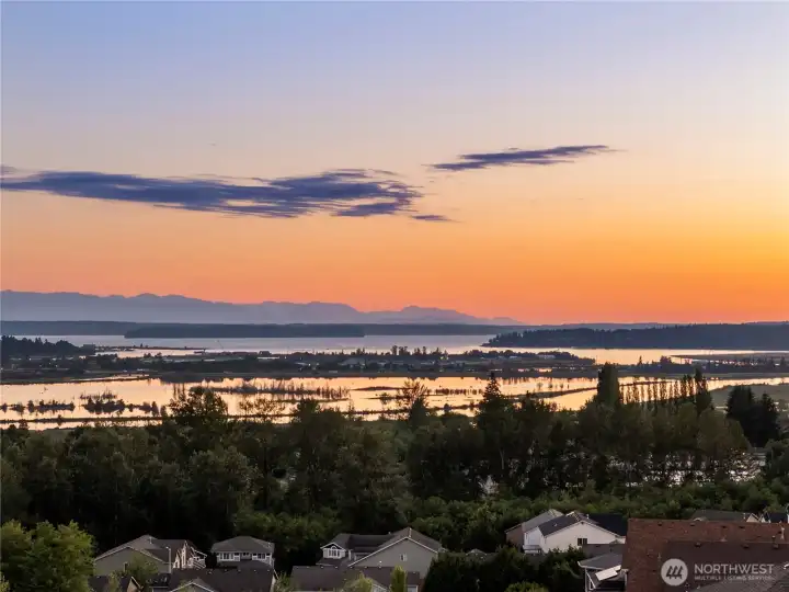The home's elevated setting shines beautifully at sunset.