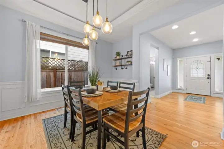 formal dining area with wainscoating