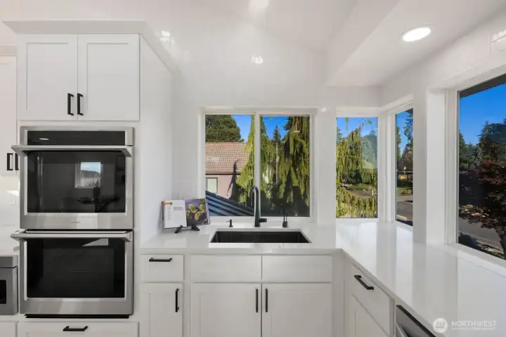 Double ovens and main sink in kitchen.
