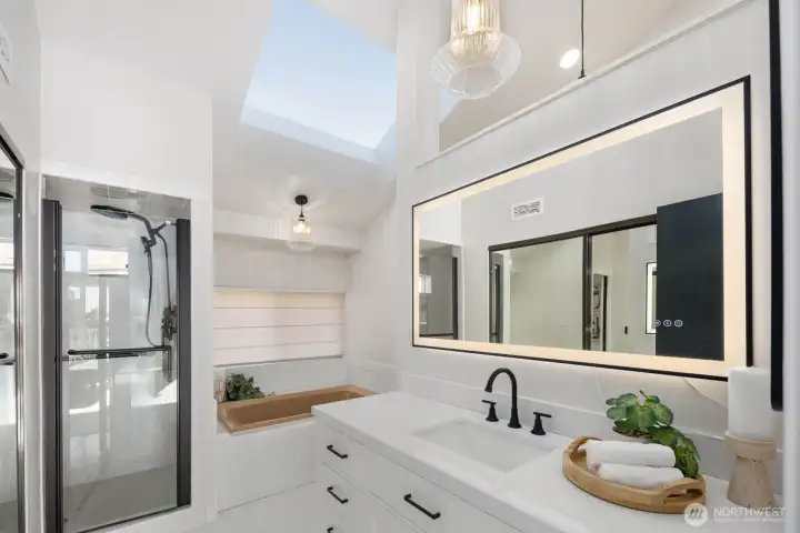 Primary bath has two sides for comfort & efficiency.