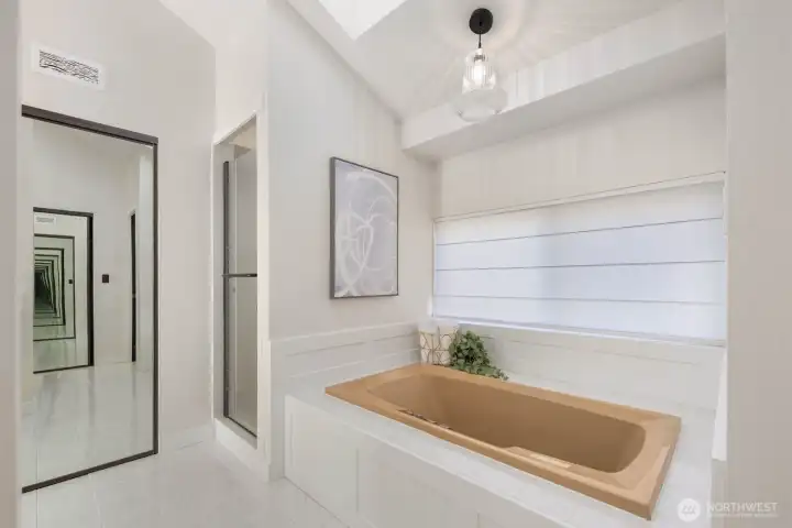 Primary jetted tub and shower.