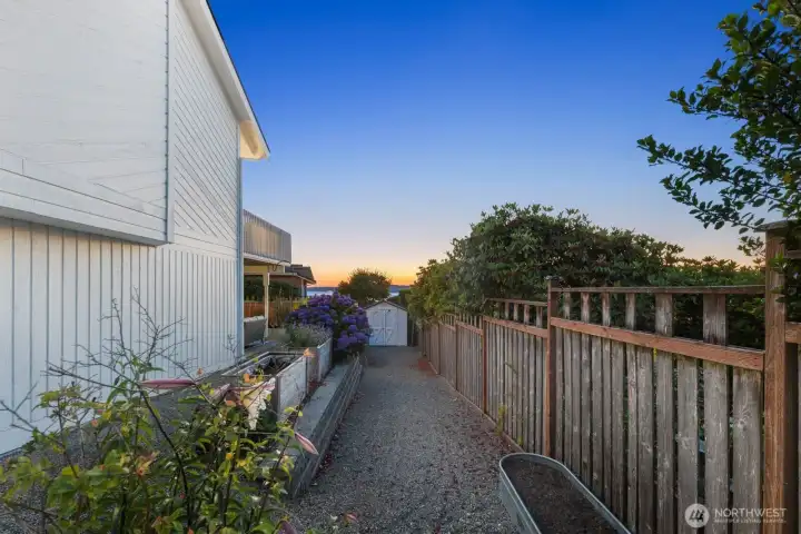 Start a garden, grow plants, the possibilities are endless for this side area heading into the back yard.