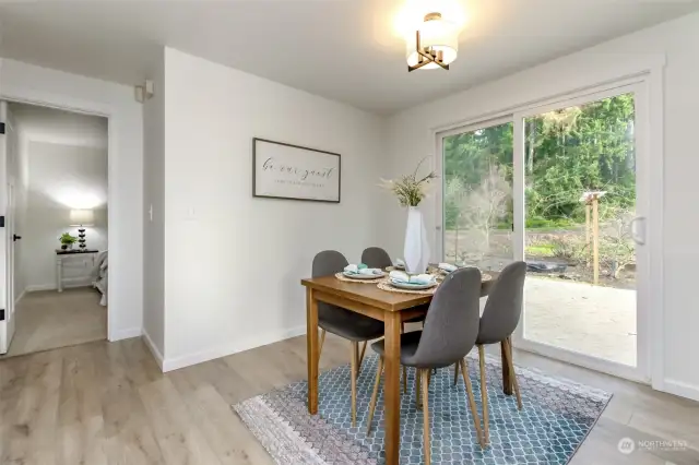 dining room with slider to expansive deck perfect for entertaining